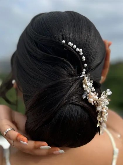 A candid shot of the model with her elegant updo, showing how beautiful and wearable the style is.