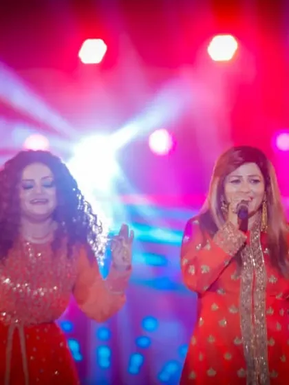The joy of singing together as sisters on a grand stage. Our shared passion for music is what drives every performance.