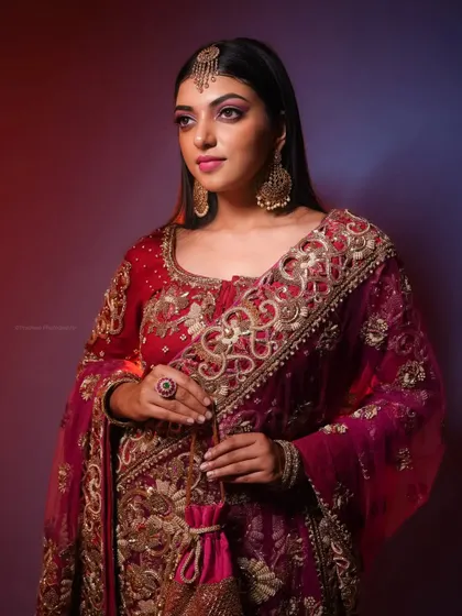A three-quarter view of the same bridal look, with creative red and blue backlighting to add a dramatic effect.