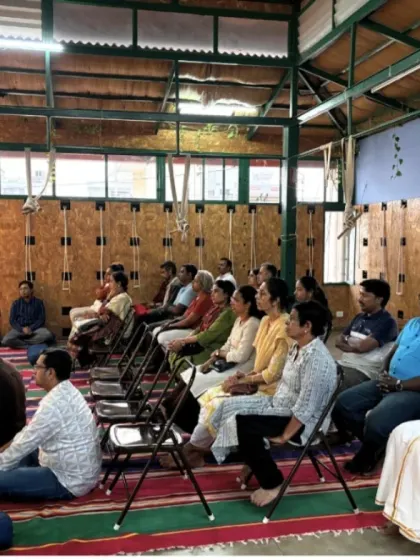 A view of the audience at the "Neuroscience of Pranayama" talk, showing the blend of in-person and virtual participation.