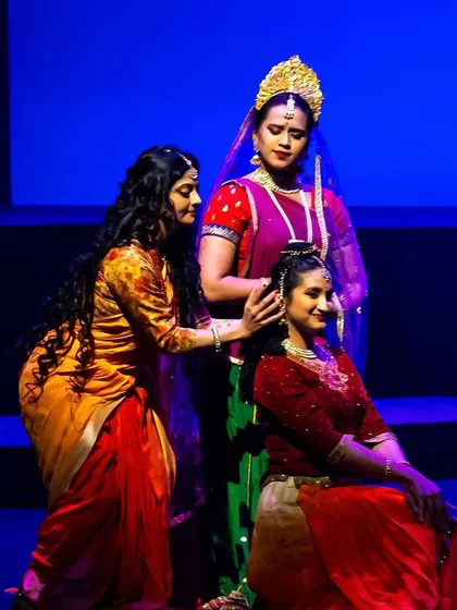 A touching scene of solace and support between three characters. Grouping dancers in this way allows for complex emotional narratives, creating beautiful stage pictures that resonate with the audience.