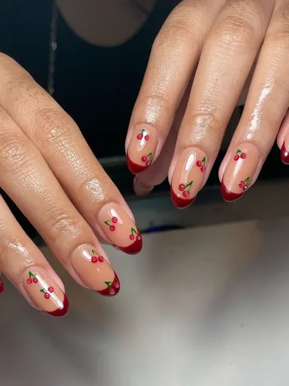 Life is sweet. This super cute design features a classic red French tip with tiny, hand-painted cherries.