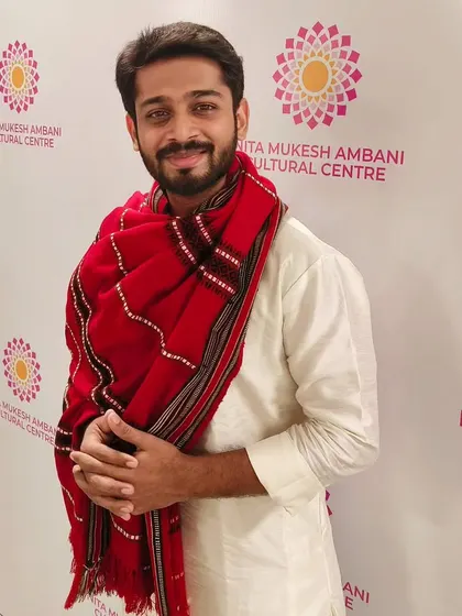 A close-up from the same event, highlighting the details of the attire and a pleasant expression. This is useful for brands focusing on accessories like shawls or stoles.