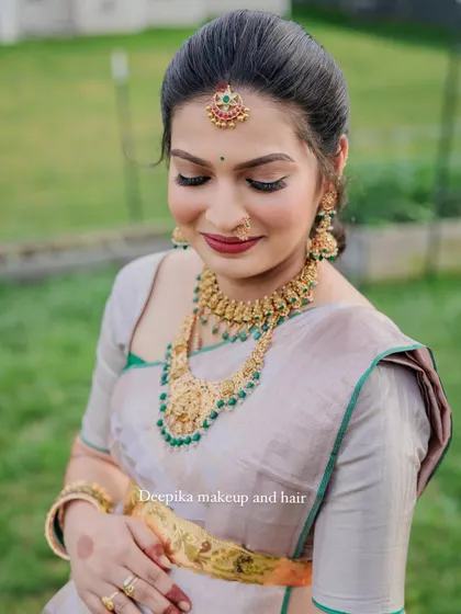 A second look for the same client's baby shower, this time in a soft, elegant grey saree for a different part of the event.