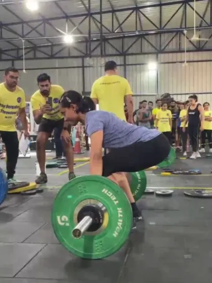 A member executes a heavy deadlift during a competition. We prepare our athletes for performance by focusing on maintaining solid form under pressure.