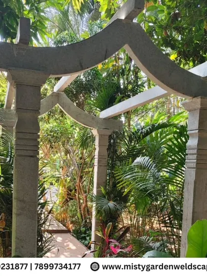 The stone arch during construction, showing the raw structure before the final capstones are placed. This showcases the solid and traditional building technique.