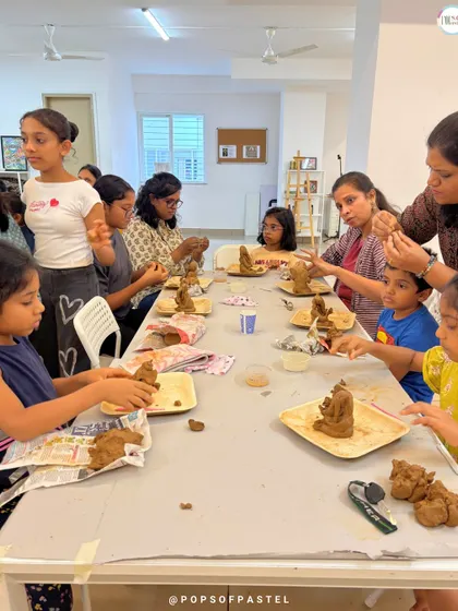 Our instructors provide hands-on help, guiding participants through the steps of molding and shaping their clay Ganeshas.