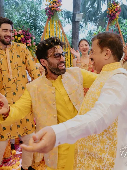 A heartwarming moment between the groom and a family member on the dance floor.