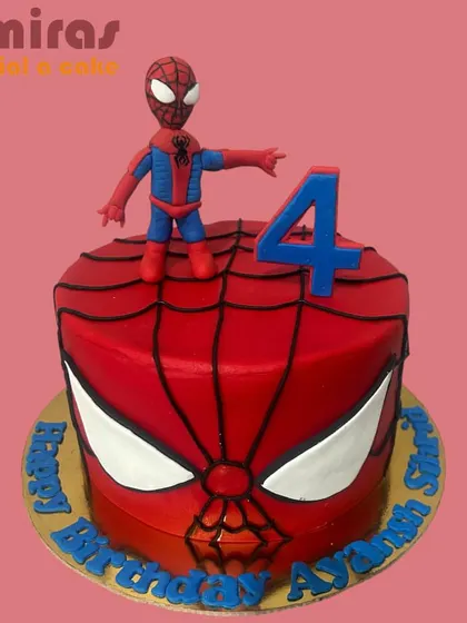 Your friendly neighborhood Spider-Man swings into the party on this vibrant cake. The design features his iconic mask, a fondant web, and a hand-sculpted Spidey figurine ready for action, perfect for a superhero's fourth birthday.