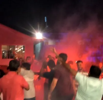 Red lighting and smoke effects kick the Godrej party into high gear.