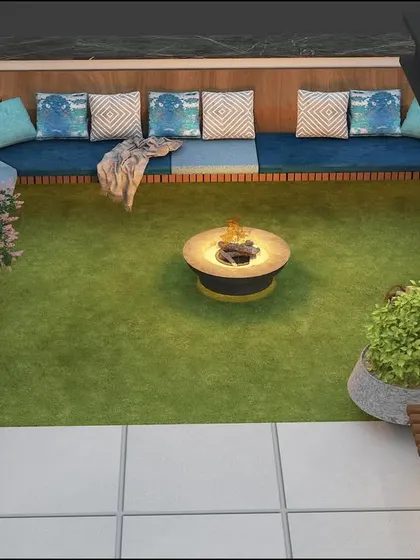 A top-down view of a sunken seating area from the same project, showing the L-shaped bench and central fire pit.