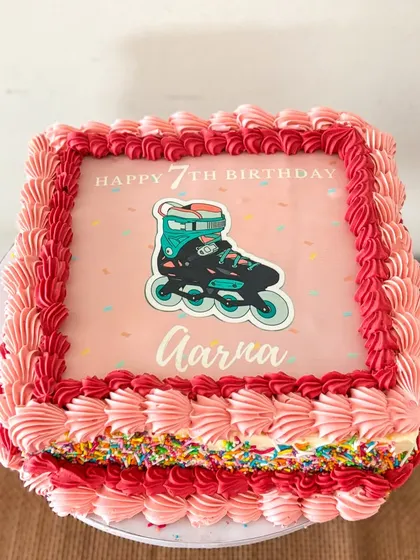 She's a skater girl! A square fault-line cake with a skater theme for Aarna's 7th birthday. The center is filled with colorful sprinkles.