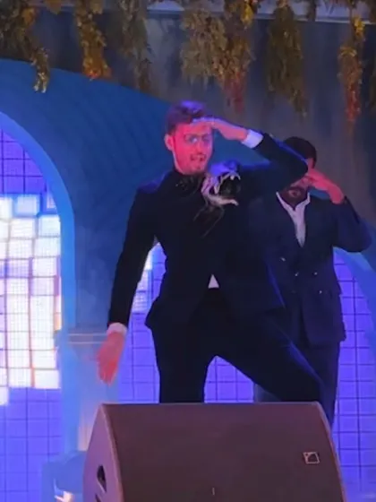 A friend of the groom puts on an energetic performance, showing how everyone gets into the spirit of the celebration.