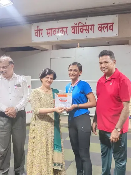 Our silver medalist receiving her certificate and medal. Every competition is a valuable experience.