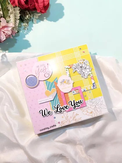 The cover of a "We Love You" scrapbook for a bride-to-be.