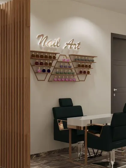 A dedicated nail art station is a must for a modern salon. This design features custom hexagonal shelves for polish display, comfortable seating, and a "Nail Art" neon sign to create a fun and stylish corner.