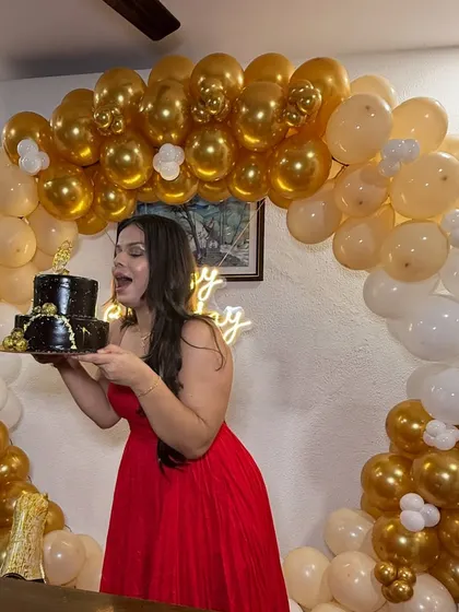 Getting ready for a birthday party! I created a glamorous look with soft smokey eyes and wavy hair for the birthday girl in her beautiful red gown.