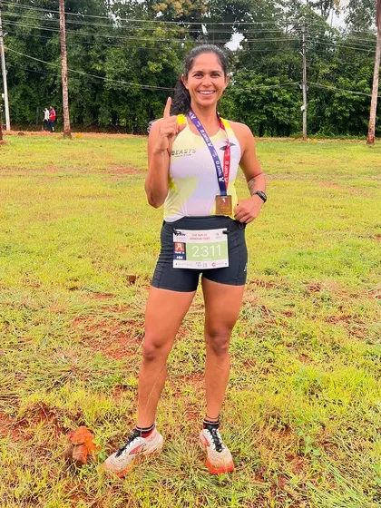 Pointing to number one after winning the TRORT Half Marathon. This was a tough course with a lot of elevation, but I love a good challenge. My programs are designed to make you strong enough for any course.