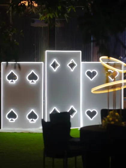 Another view of the illuminated card suit panels, a popular and stylish backdrop for guests at our Diwali celebrations.