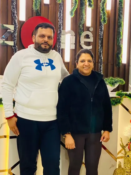 A couple who trains together, celebrates together. Our members enjoying the Christmas spirit at the club.