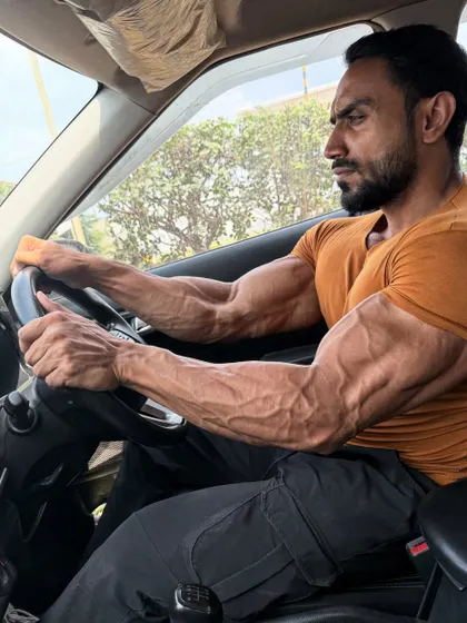 The forearm and bicep veins are a sign of low body fat and good conditioning.
