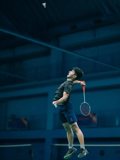Reaching for the top. A young player executes a high jump smash, demonstrating the advanced techniques taught in our AWSB training programs.