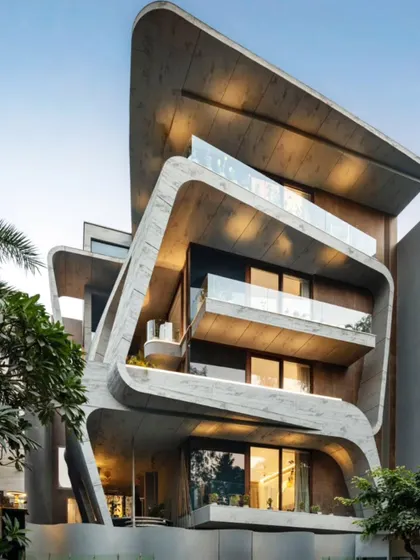 This home is a symphony of concrete and creativity. I designed this facade to be a living sculpture, where fluid lines and bold forms create a home that is as extraordinary to behold as it is to live in.