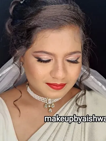 This is the same elegant Christian bridal look, focusing on the soft glow of the skin and the classic red lip. It's a timeless choice that photographs beautifully.
