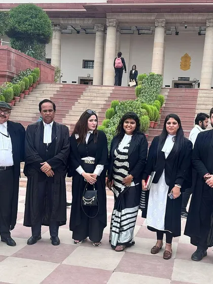 Standing with my esteemed colleagues on the steps of the Supreme Court. Being part of this legal community is a privilege.