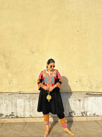 A full-length view of the Afghan-inspired suit, perfect for a Sangeet or a festive music night.