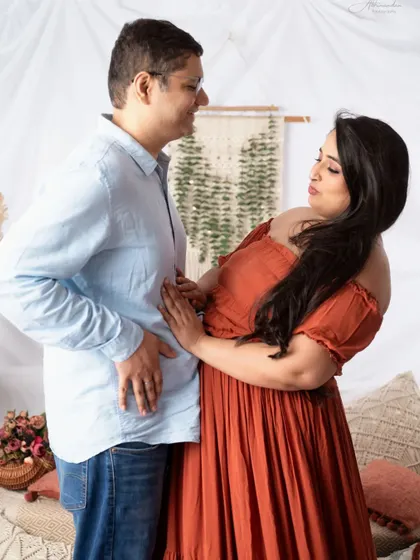 A fun, candid moment between the couple during their boho-themed session. We love capturing these playful interactions.
