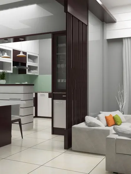 An open-plan layout showing the seamless transition from the living area to the dining and kitchen spaces. The design uses a consistent color scheme and flooring to unify the different zones while a wooden partition adds a touch of separation.