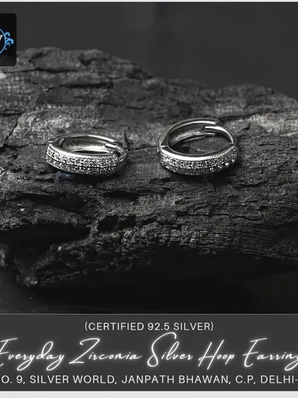 Another view of our everyday zirconia silver hoop earrings, showing the detail of the stones and the secure clasp mechanism.