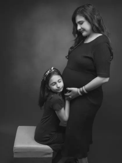 A bond that’s already blossoming. This tender black and white connection between a mother and daughter tells a story of love, anticipation, and family.