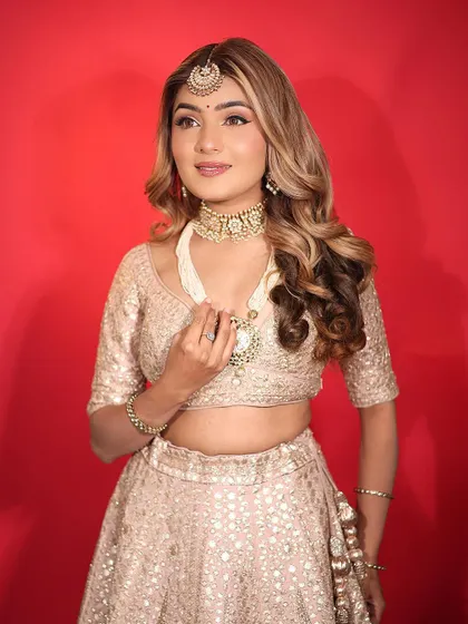 The full look, showing how the soft makeup and wavy hair create a romantic and ethereal vibe. This is perfect for a sundowner wedding or daytime event.