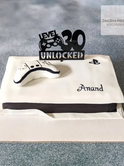 Level 30 unlocked. This PS5 cake was made for a gamer's milestone birthday. Even the controller is carved from cake and detailed with fondant.
