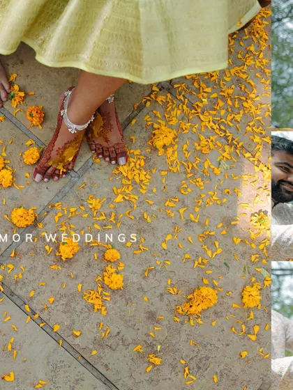 An artistic shot focusing on the details on the ground. The bride's feet, adorned with anklets and turmeric, surrounded by scattered marigold petals, makes for a beautiful composition.