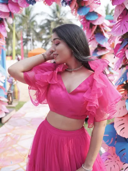A candid moment in my favorite pink outfit. I believe that when you feel good in what you wear, it shows in your performance.