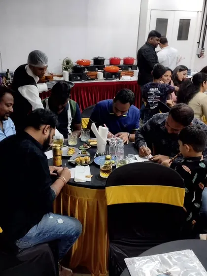 Guests fully engaged in one of the written games. Whether it's baby trivia or a quiz about the parents, these activities are a great icebreaker.