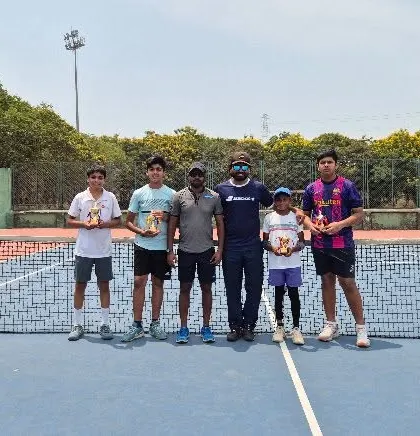 Our victorious players with their coach after a successful tournament at ASA Academy.