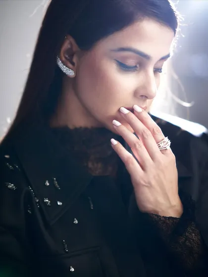 A beauty-focused shot that draws attention to the sparkling diamond ear cuff and Genelia's flawless makeup. Accessories are everything.