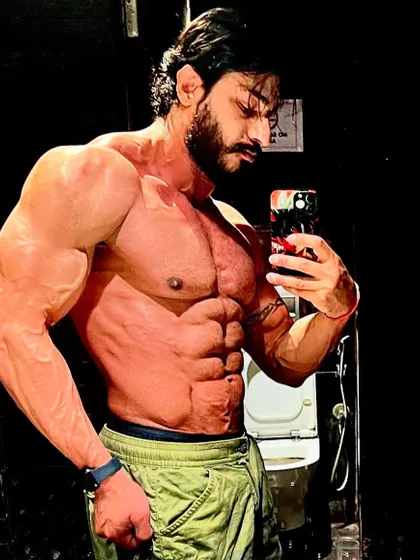 A powerful pose showing chest and arm definition. Staying lean allows you to appreciate the muscle you've built.