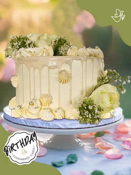 A graceful and gorgeous cake for Aashna's birthday in Gurugram. This elegant white drip cake is adorned with fresh white roses and delicate baby's breath, perfect for a sophisticated celebration.