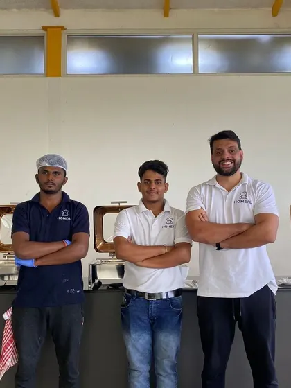 Our staff ensuring the buffet line is perfectly managed during a corporate lunch service. We handle everything from setup to service, making office catering completely stress-free for you.