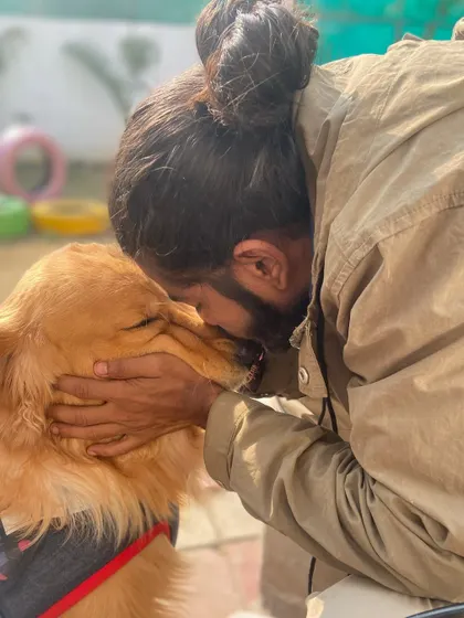 Fur-ever love. A quiet moment of affection with a beautiful Golden Retriever after a long day of play.