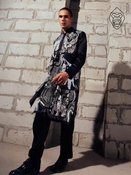 The Mythic Tapestry kurta, sculpted in noir and layered with symbolism. This piece is tailored for the modern man who appreciates a story woven into his wardrobe.