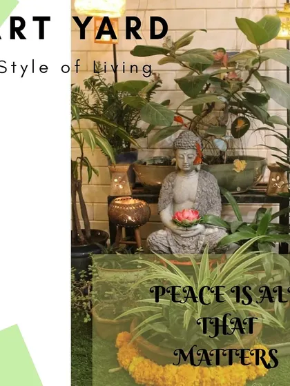 A balcony garden centered around a peaceful Buddha statue, surrounded by a variety of plants in different pots. This setup is designed to be a personal space for meditation and calm.