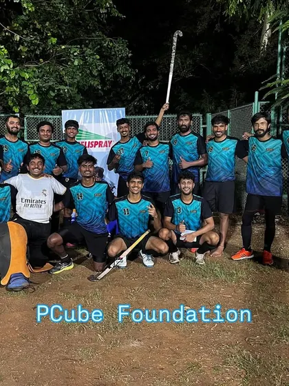 The victorious PCube Foundation team poses for a photo after a successful tournament. These moments of celebration build lasting bonds and motivate us for future competitions.