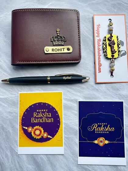 A simple and thoughtful Rakhi combo. This set includes a personalized men's wallet, a sleek black pen with a name, and a custom MDF name rakhi, complete with two greeting cards.