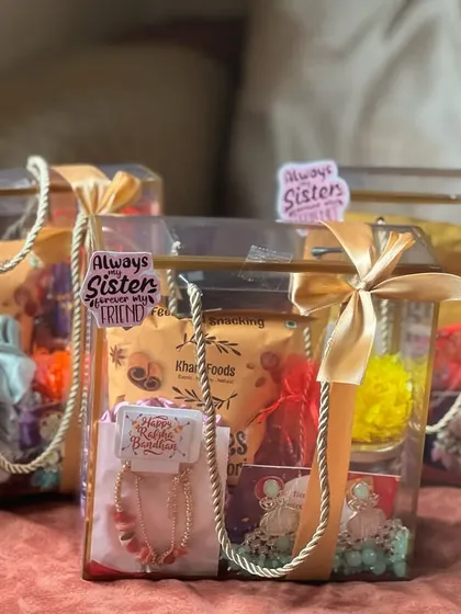 These matching Rakhi gift bags are perfect for sisters. Each clear tote contains snacks, jewelry, and scrunchies, with a sticker that reads "Always sisters, forever friends."